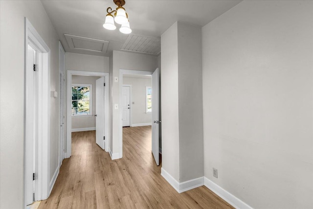 hall with light hardwood / wood-style floors