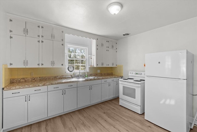 kitchen featuring white cabinets, light wood-type flooring, white appliances, and sink