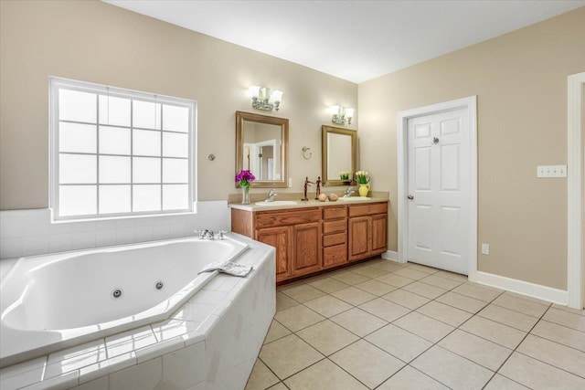 bathroom with vanity, a relaxing tiled tub, and tile patterned floors