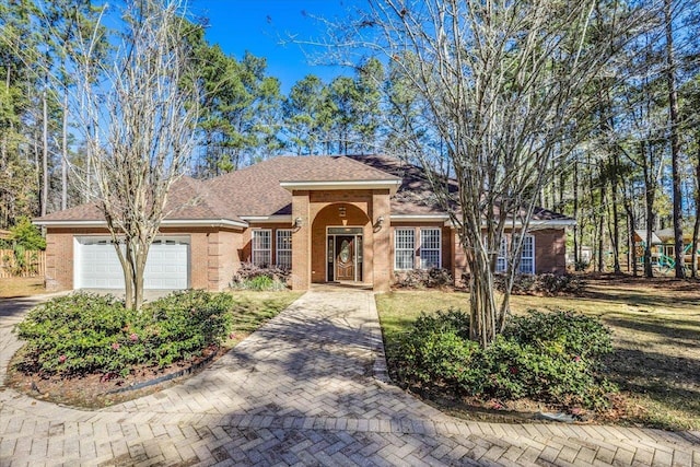 ranch-style home with a garage