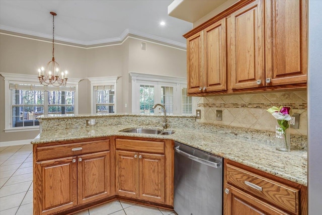 kitchen featuring sink, dishwasher, hanging light fixtures, ornamental molding, and kitchen peninsula