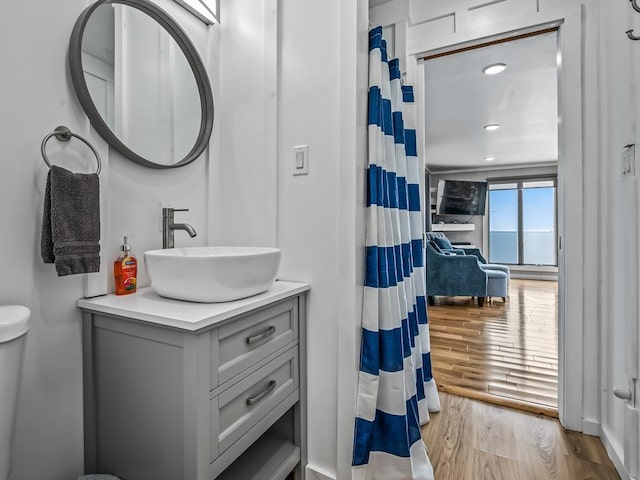 1171 Alligator Dr, Alligator Point, FL 32346 - full bath with wood finished floors, vanity, curtained shower, recessed lighting, and toilet