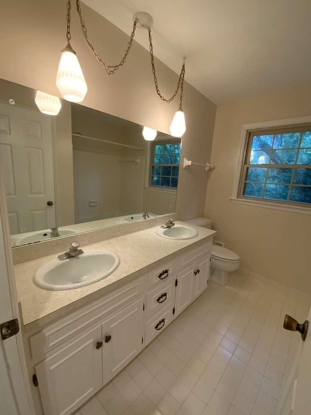 bathroom featuring vanity and toilet