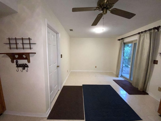 entrance foyer featuring ceiling fan