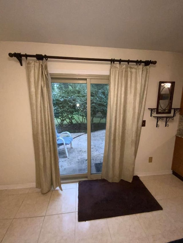 entryway with light tile patterned floors