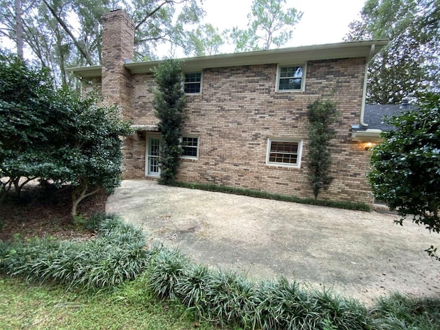 back of property featuring a patio