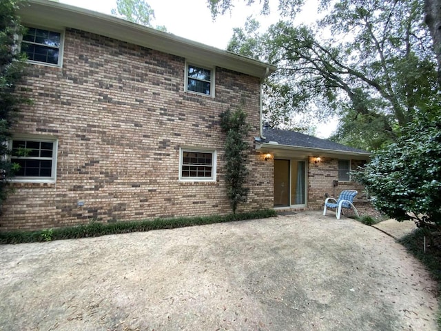 back of property with a patio