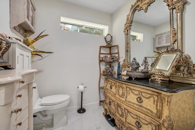 5902 Shady Rest Rd, Havana, FL 32333 - bathroom featuring toilet, marble look tile flooring, and vanity