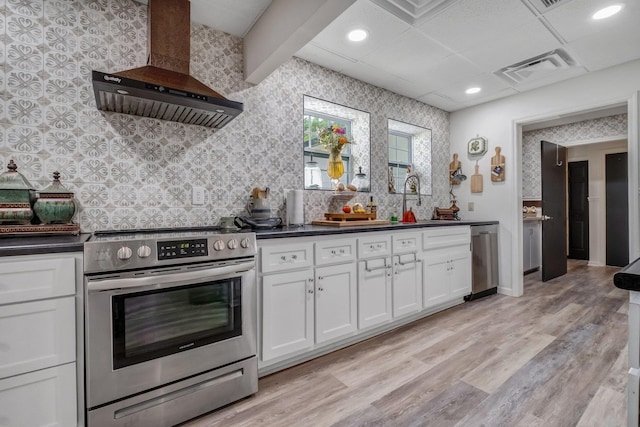 5902 Shady Rest Rd, Havana, FL 32333 - kitchen featuring stainless steel appliances, wallpapered walls, wall chimney exhaust hood, dark countertops, and a sink