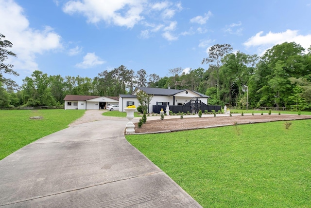 5902 Shady Rest Rd, Havana, FL 32333 - modern inspired farmhouse with driveway, view of wooded area, and a garage