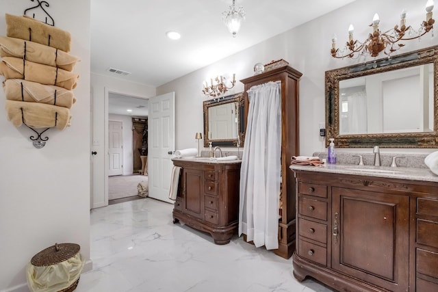 5902 Shady Rest Rd, Havana, FL 32333 - bathroom with marble finish floors, recessed lighting, and two vanities
