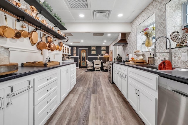 5902 Shady Rest Rd, Havana, FL 32333 - kitchen with appliances with stainless steel finishes, dark countertops, a sink, open shelves, and wallpapered walls