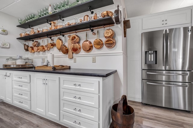 5902 Shady Rest Rd, Havana, FL 32333 - bar featuring stainless steel fridge with ice dispenser and light wood-style flooring