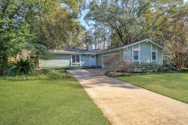 single story home featuring a garage and a front yard