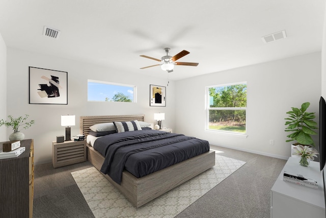 carpeted bedroom with ceiling fan