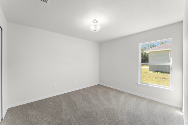 empty room with carpet flooring