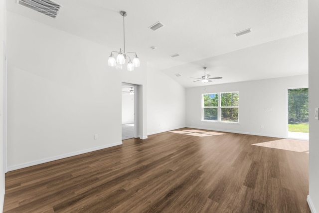 unfurnished room featuring ceiling fan with notable chandelier, dark wood-type flooring, and lofted ceiling