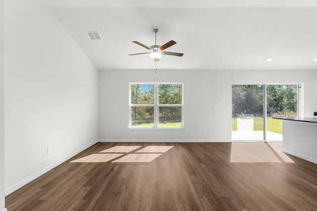 unfurnished room with ceiling fan and dark hardwood / wood-style flooring