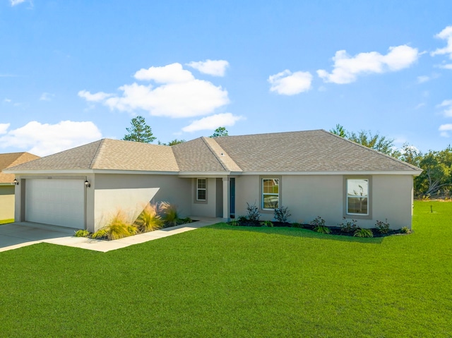 ranch-style house featuring a garage and a front lawn