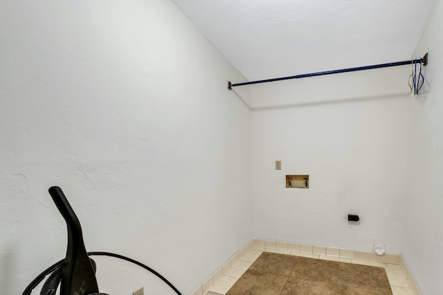 washroom with washer hookup and tile patterned floors