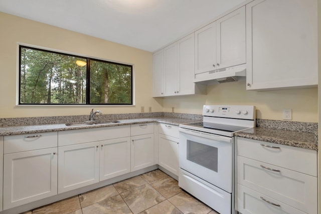 kitchen with white range with electric stovetop, light stone countertops, sink, and white cabinets