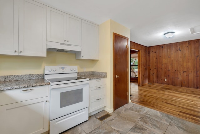 kitchen with white cabinetry, light hardwood / wood-style floors, and white range with electric cooktop
