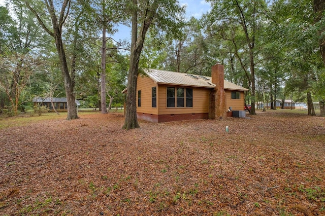 view of property exterior with central AC unit