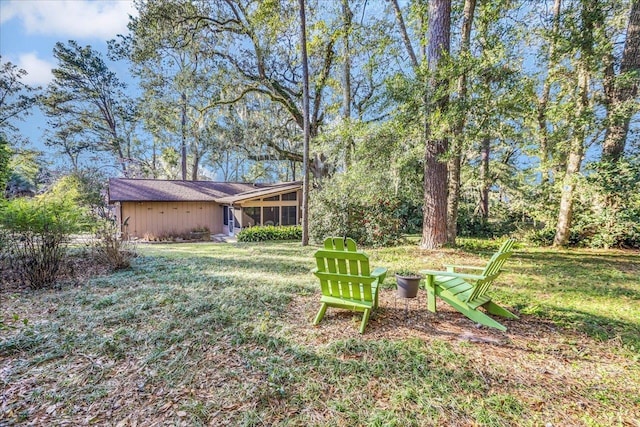 view of yard featuring a sunroom