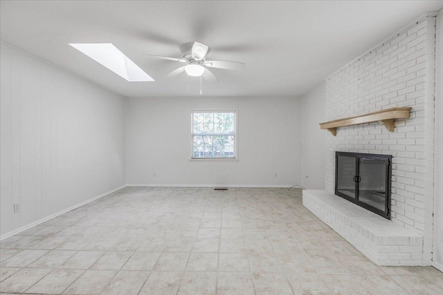 unfurnished living room featuring visible vents, a fireplace, a ceiling fan, and baseboards