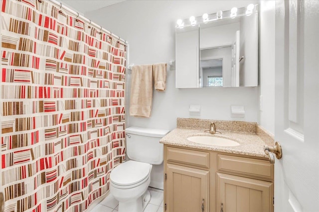 full bathroom with tile patterned flooring, a shower with shower curtain, vanity, and toilet