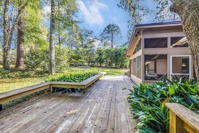 wooden deck featuring a sunroom