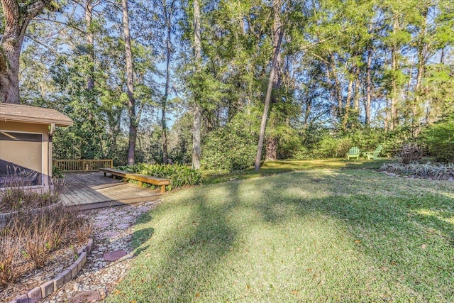 view of yard featuring a wooden deck