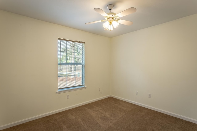 empty room with carpet floors and ceiling fan