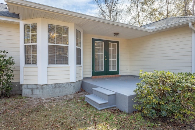 view of exterior entry featuring french doors