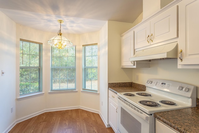 kitchen with white electric stove, white cabinetry, a wealth of natural light, and pendant lighting