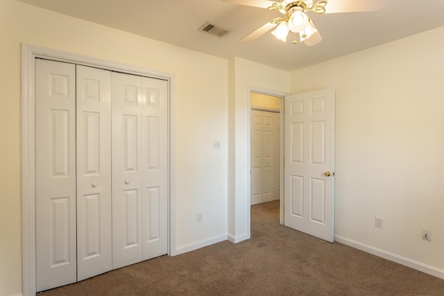 unfurnished bedroom with carpet floors, ceiling fan, and a closet