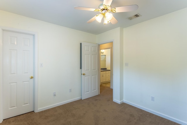 unfurnished bedroom with ceiling fan and carpet