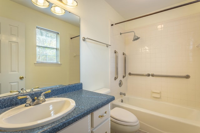 full bathroom with vanity, toilet, and tiled shower / bath combo