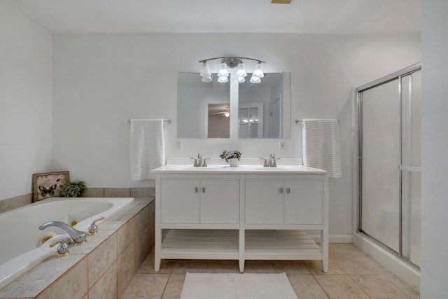 bathroom featuring vanity, tile patterned flooring, and separate shower and tub