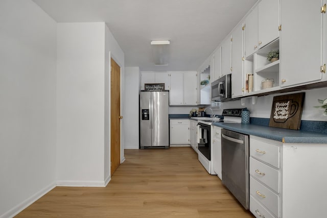 kitchen with light wood-type flooring, white cabinetry, sink, and stainless steel appliances