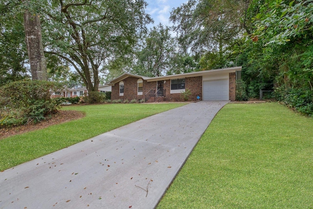 single story home with a garage and a front lawn