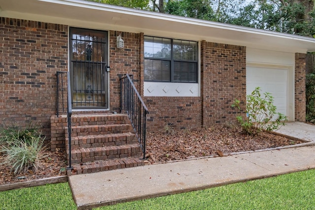 entrance to property featuring a garage