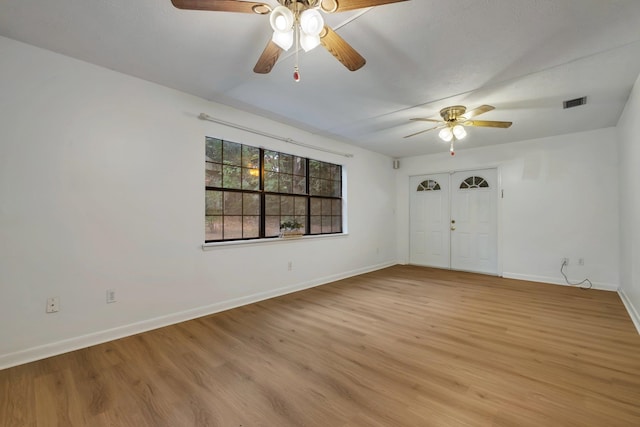 spare room with ceiling fan and light hardwood / wood-style flooring