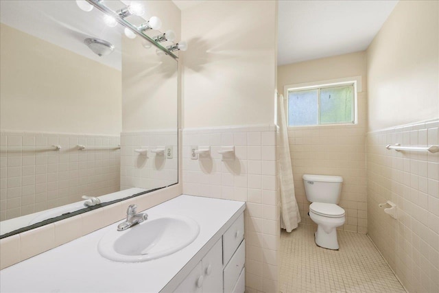 823 Salter Rd, Quincy, FL 32352 - full bath with tile walls, toilet, wainscoting, tile patterned flooring, and vanity