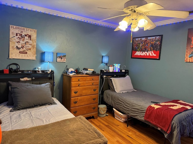 bedroom featuring ceiling fan and wood finished floors