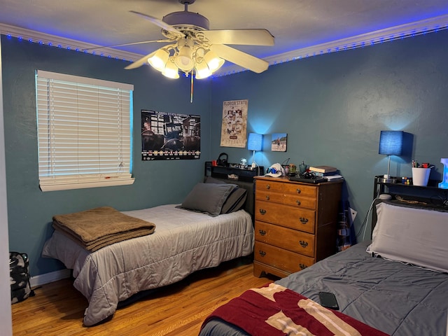 bedroom featuring a ceiling fan and wood finished floors