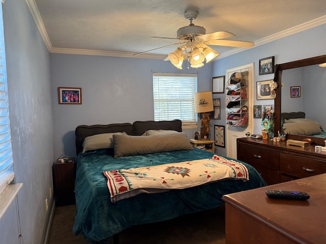 bedroom with ceiling fan and ornamental molding