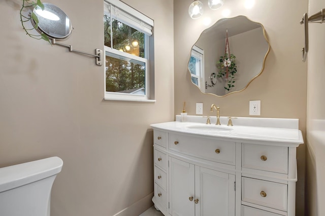 1310 E 7th Ave, Tallahassee, FL 32303 - bathroom featuring toilet, vanity, and baseboards