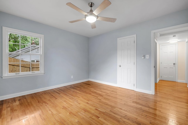 1310 E 7th Ave, Tallahassee, FL 32303 - empty room with light wood-style floors, baseboards, and a ceiling fan