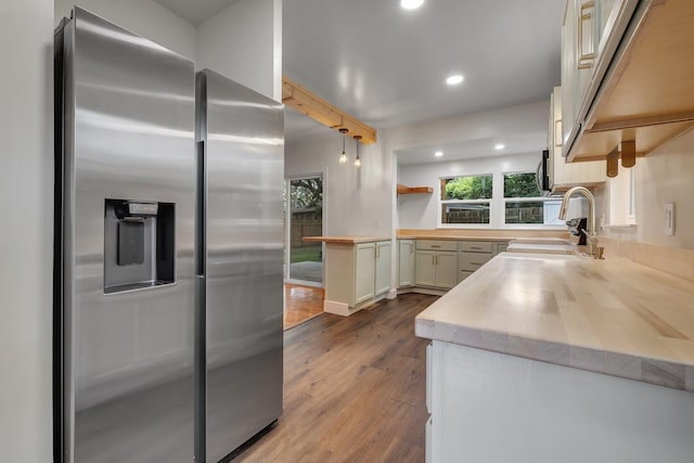 1310 E 7th Ave, Tallahassee, FL 32303 - kitchen featuring stainless steel fridge with ice dispenser, a sink, dark wood-style flooring, butcher block counters, and recessed lighting